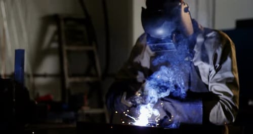 Welder welding a metal