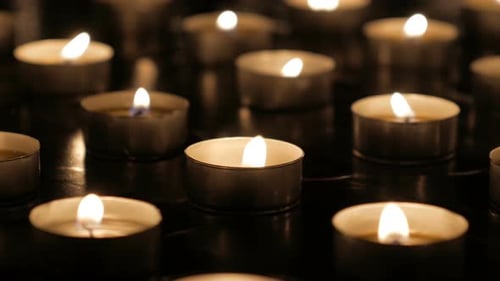 Many Candles Burning Peacefully in the Darkness