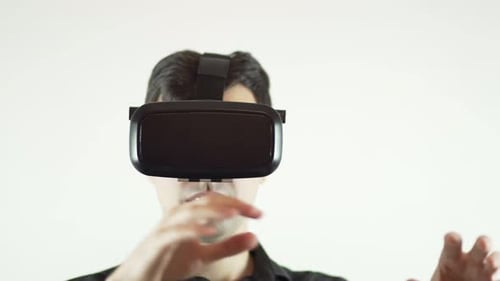 Man Wearing VR Headset Experiencing Virtual Reality