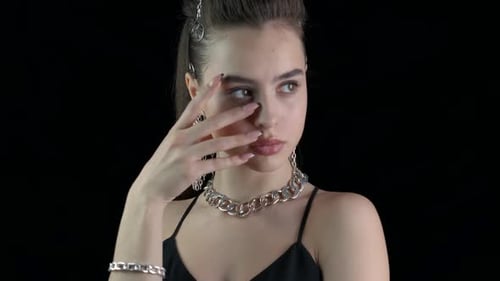 Stylish Woman Posing with Chunky Silver Jewelry