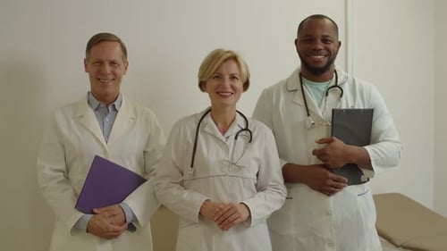 Portrait of Friendly Diverse Multiethnic Medical Team Smiling at Medical Office