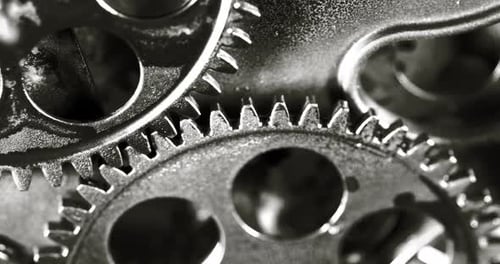 Rotating Gears Interlocked, Mechanical Precision in Black and White