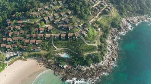 Aerial Orbiting Shot of Narrow Roads By the Cliff Along the Ocean Shore