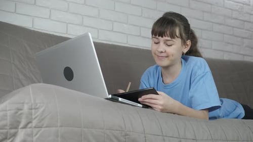Child Learning Online Using a Laptop at Home