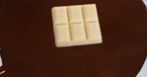 White Chocolate Splashing into Melted Brown Chocolate