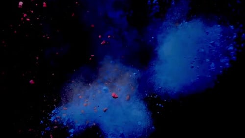 Farbstoß aus blauem und rotem Pulver