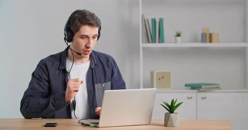 Young Man on Video Call in Home Office
