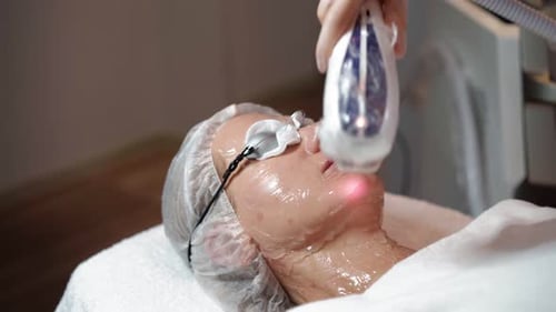 Woman Receives Advanced Skincare Treatment in Clinic