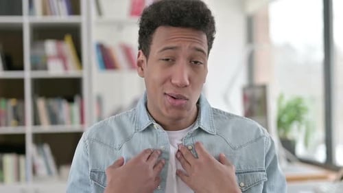 Young Adult Talking and Gesturing Directly To Camera