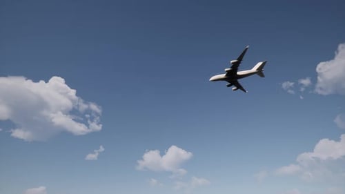 Airliner Flying Through Blue Sky with White Clouds