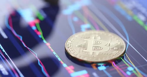 Bitcoin Coin on Financial Chart with Finger Interaction