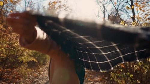 Woman Walking and Smiling in Autumn Forest