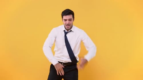 Man Dancing Joyfully on a Yellow Background