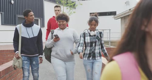 Students walking in their high school grounds