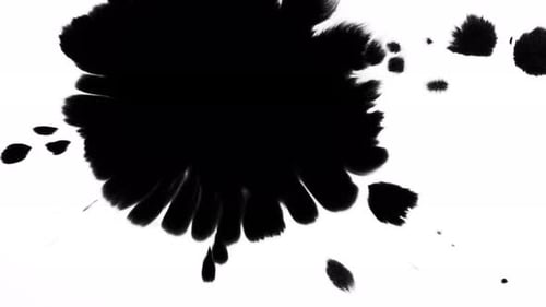 Black Ink Blot Expanding on White Background