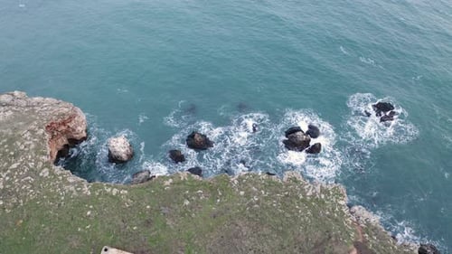 Rugged Coastline Waves Crashing on Rocky Shore