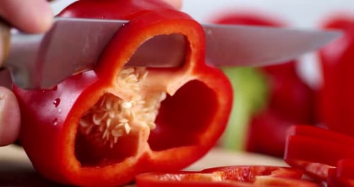 Slicing Fresh Red Pepper with Sharp Knife