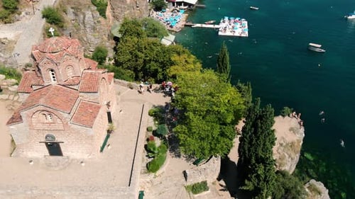 Aerial shot of Macedonia coast. Clif and beautiful water around Ohrid Lake in Southern Europe. Churc