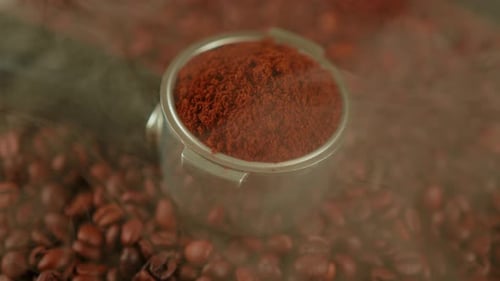 Close Up of Coffee Grounds on Coffee Beans