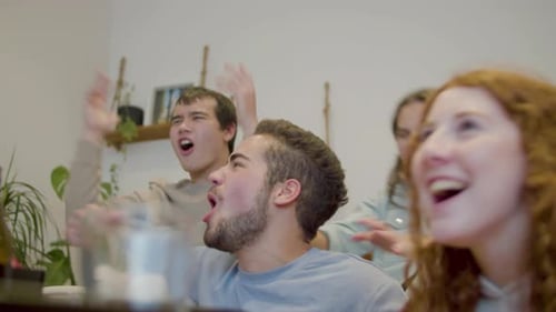 Sports Fans Screaming and Laughing After Soccer Teams Victory