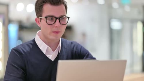 Young Man in Office Making Video Call