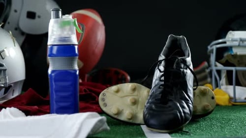 American Football Gear Display with Helmet and Cleats