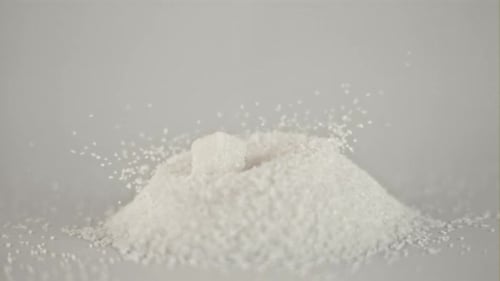 Super Slow Motion Drop Pieces of White Sugar