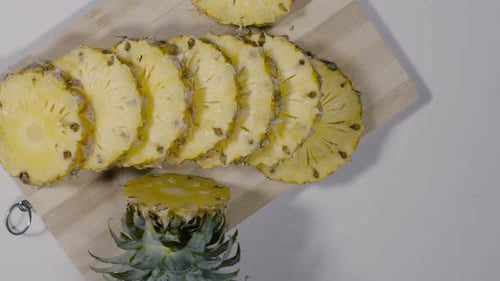 Fresh Pineapple Slices on Wooden Board