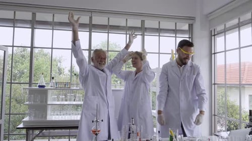Scientists Celebrate Successful Lab Experiment