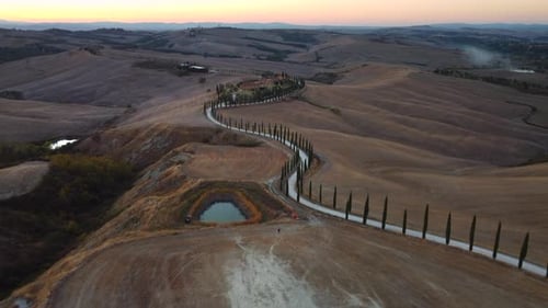 Crete Senesi Tuscan Rolling Hills and Cypress Road Aerial View in Tuscany
