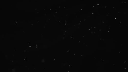 White Dust Debris Falling on Black Background