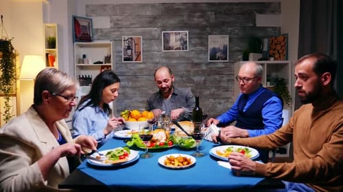 Family Sharing Meal and Wine Together at Home