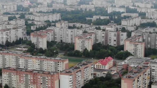 Aerial View of Apartment Blocks in Ukraine on a Cloudy Day Descending Slowly