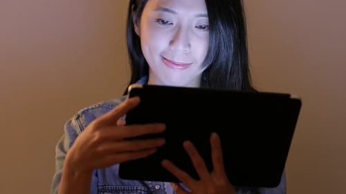 Woman Typing on Digital Tablet