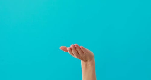 Arm Holding Upward on Blue Background