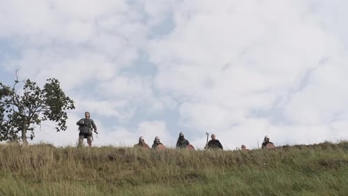 Medieval Warriors Armed With Swords and Shields on Hill