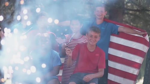 Children Celebrate with American Flags and Sparklers