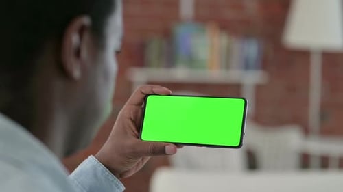 African Man Watching Chroma Key Smartphone Screen