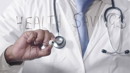 Doctor Writing Health Savings Account with Marker