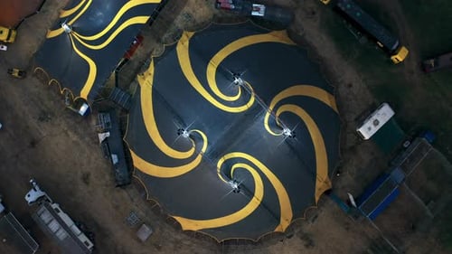 Big Top of a Circus with Caravans in a Field