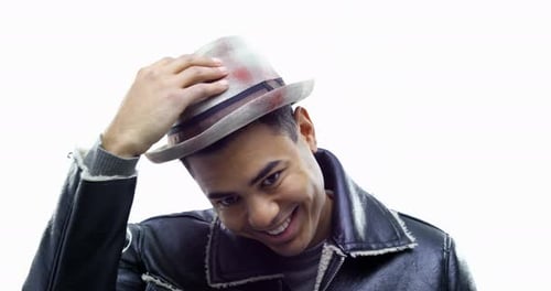 Young Man Surprised by Falling Hat