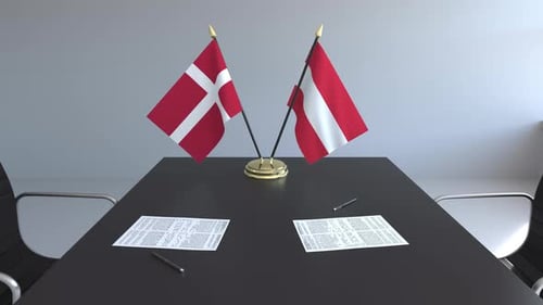 Denmark and Austria Flags Diplomatic Meeting Table Scene