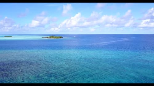 Aerial drone shot seascape of marine coast beach trip by turquoise ocean and white sand background o