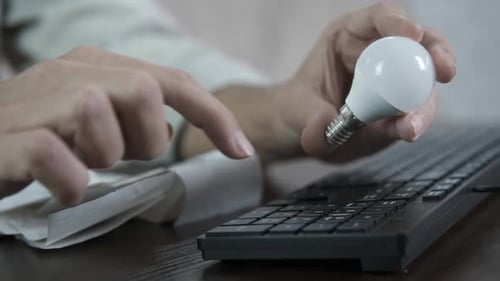 Typing on Keyboard with Lightbulb Energy Saving Ideas