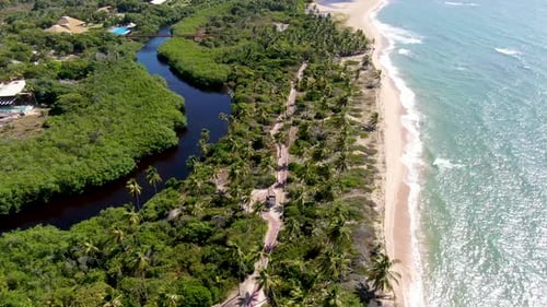 Aerial View of Tropical White Sand Beach and Turquoise Clear Sea Water with Small Waves.