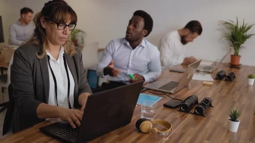 Business team of diverse people doing strategic planning work inside modern office - Entrepreneurshi