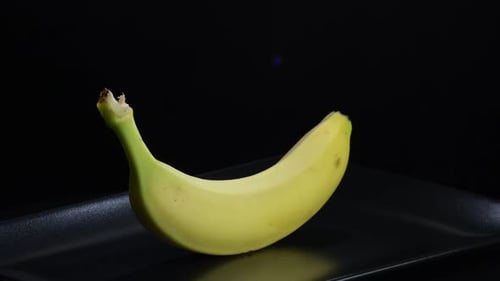 Close Up of a Banana on Black Plate