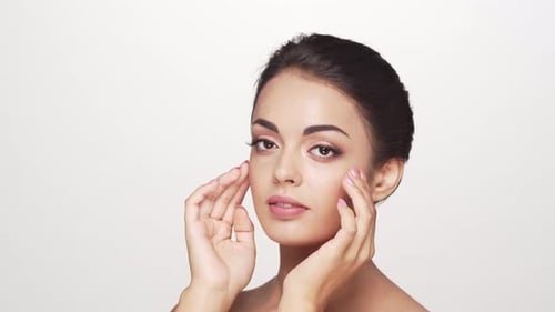 Studio portrait of young and beautiful brunette woman over