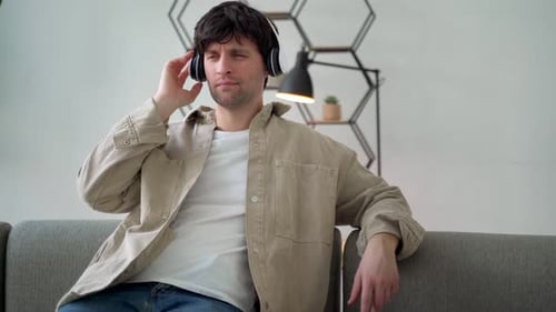 Young Adult Listening to Music with Headphones