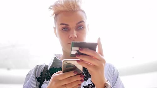 Close Up Hands Holding Credit Card and Using Mobile Smart Phone Indoor, Online Shopping, Woman Happy